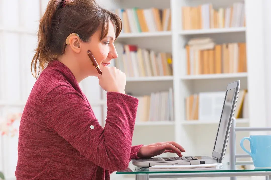 Patient coordinator on laptop