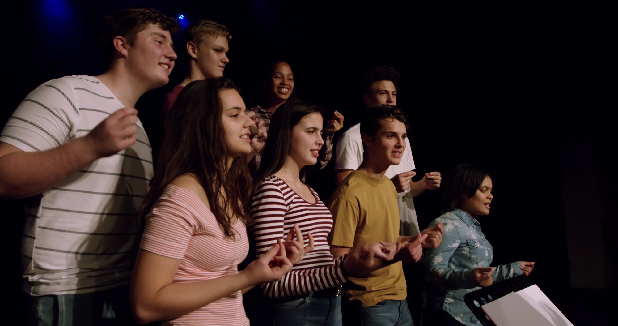 teenagers-rehearsing-in-a-theatre-SBI-349395275